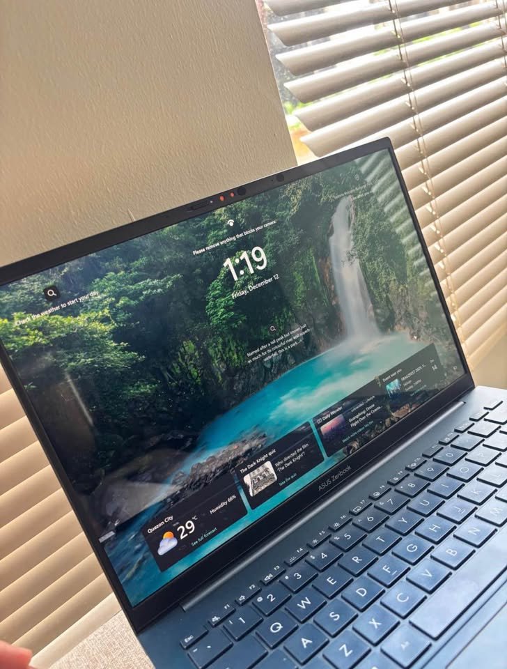 ASUS Zenbook 14 Core Ultra 5 Series 2 laptop open on a desk, screen and keyboard close-up