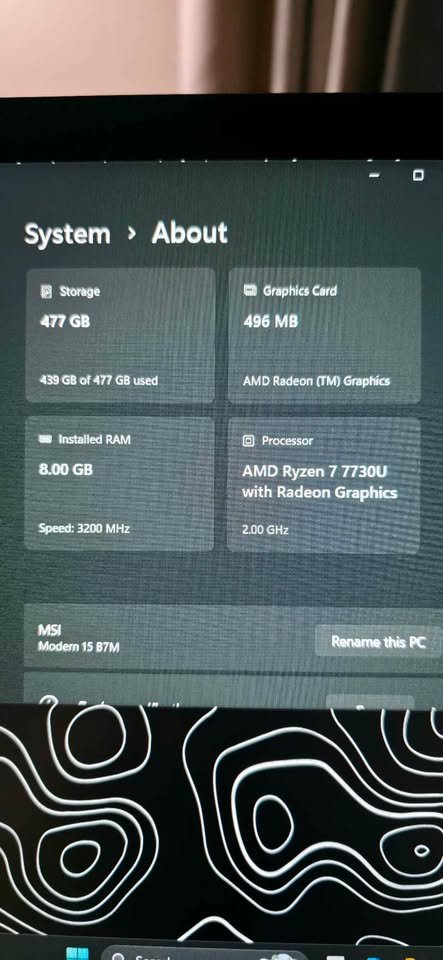 Windows system about screen showing AMD Ryzen 7 7730U processor with Radeon Graphics, 8GB RAM, and 477GB storage on MSI laptop