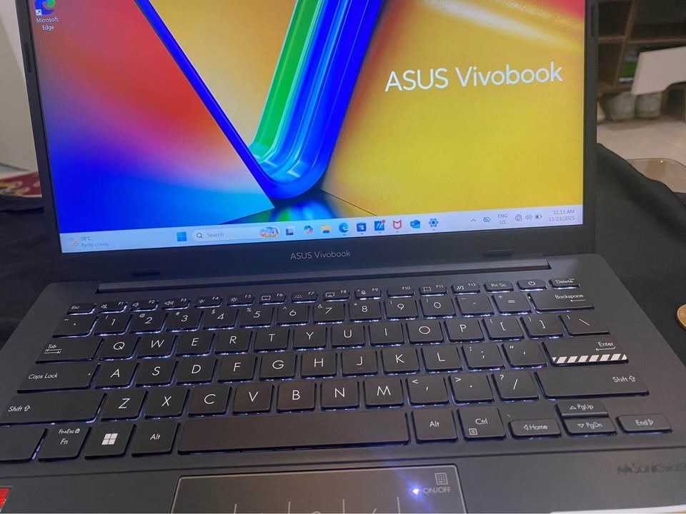 ASUS Vivobook Go 14 laptop keyboard with backlit keys and slim bezel display