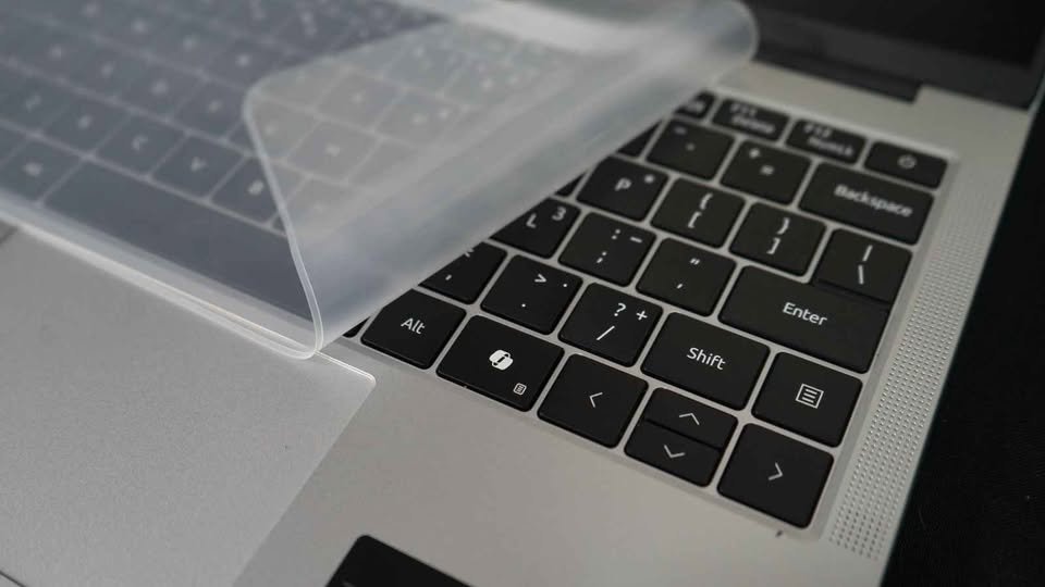 Laptop keyboard with removable transparent keyboard cover on Acer Aspire Lite