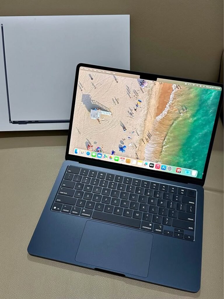 Apple MacBook Air 13-inch (M4) in Midnight colour, open laptop showing keyboard and display