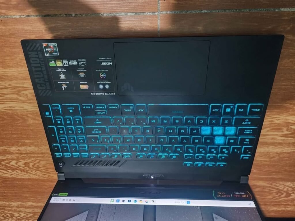 ASUS TUF Gaming A15 keyboard view with RGB backlit keys and Ryzen 7 7435HS processor
