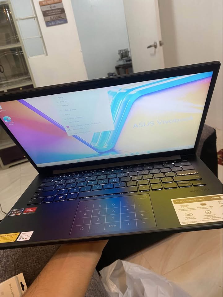 ASUS Vivobook Go 14 portable laptop showing keyboard layout and widescreen display