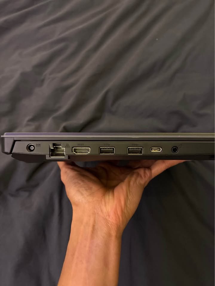 Close-up of ASUS TUF A15 ports: charging jack, Ethernet, HDMI, 2× USB‑A, USB‑C, and 3.5 mm combo audio
