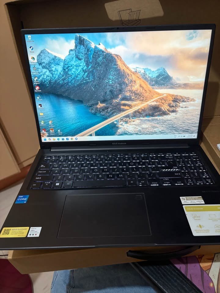 Front view of ASUS Vivobook 15 Intel Core i5 13420H 13th Gen laptop with display on, black keyboard, precision touchpad, and slim bezels