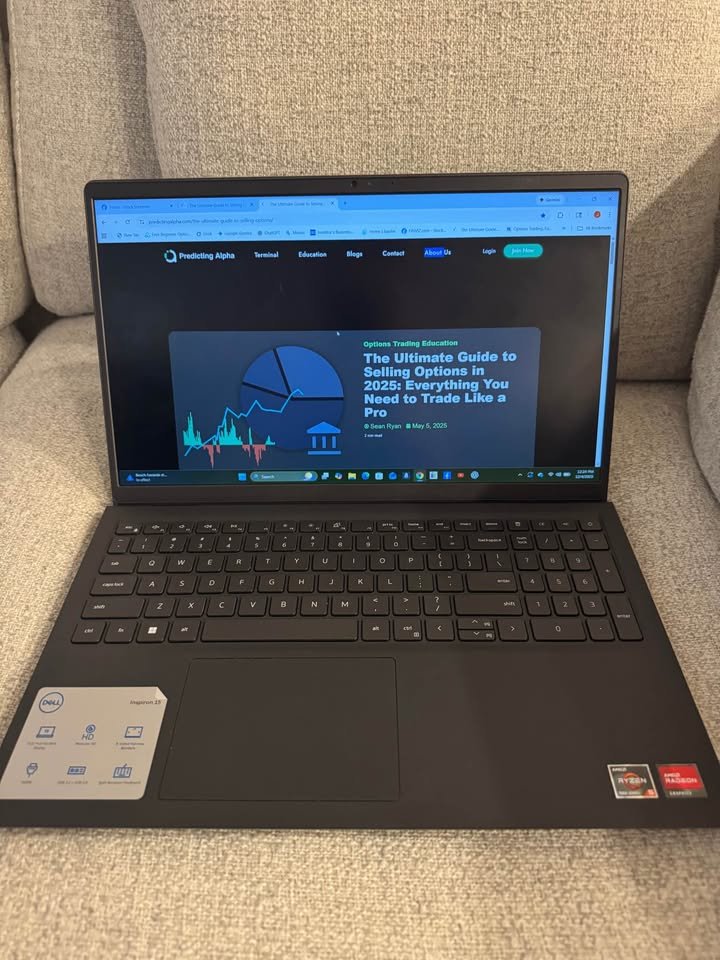 Hands-on photo of Dell Inspiron 15 3535 laptop featuring AMD Ryzen 5 7520U processor and ergonomic keyboard design