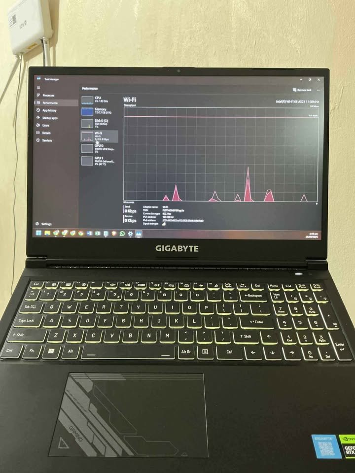 GIGABYTE G5 MF5 gaming laptop showing Wi-Fi performance in Windows Task Manager with Intel Wi-Fi 6E