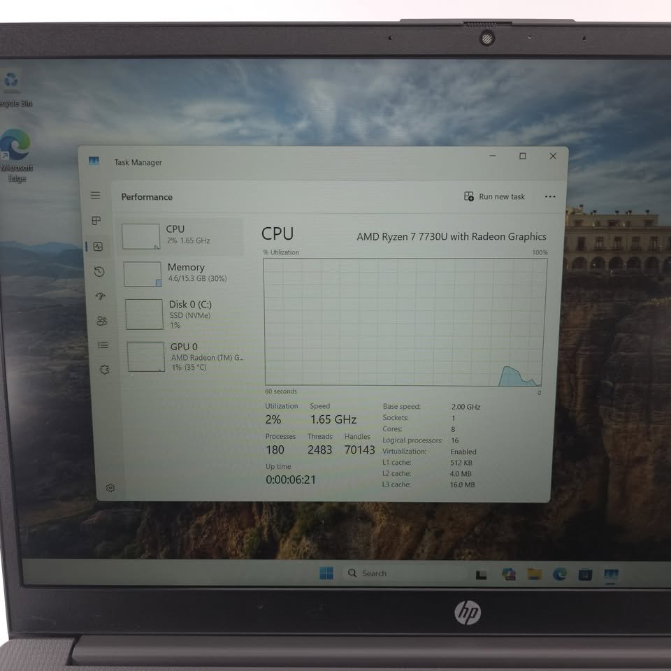 HP 255 G10 laptop performance screen confirming AMD Ryzen 7 7730U processor, base clock 2.0 GHz and Radeon Graphics