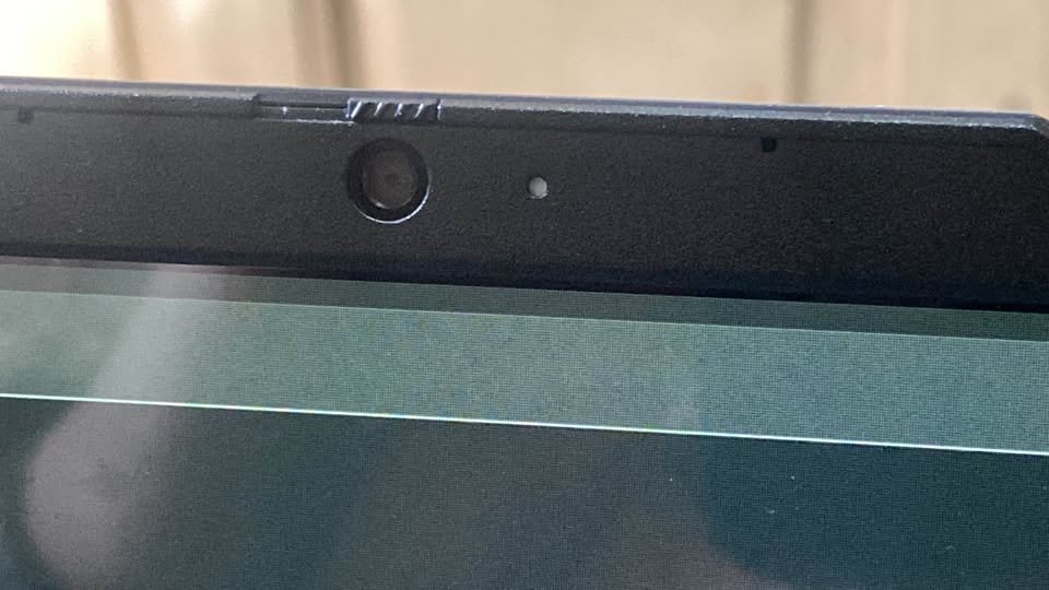 Close-up of Lenovo IdeaPad Slim 3 webcam privacy shutter and microphone on the top display bezel