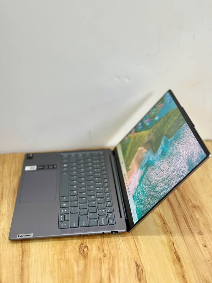 Left-side view of Lenovo Yoga Slim 7 Intel Core Ultra 5 125H laptop, highlighting the side port cutouts and slim chassis