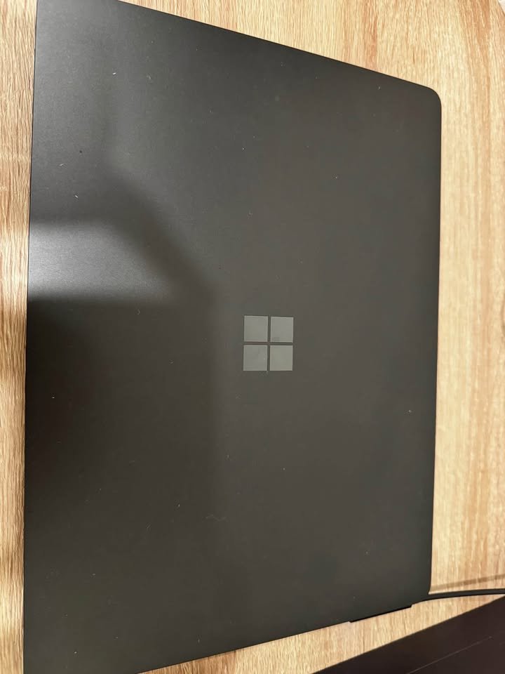 Matte black finish on the Microsoft Surface Laptop lid with subtle centered Microsoft logo