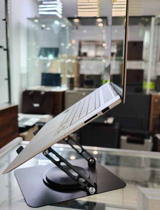 ASUS Zenbook S 16 laptop showing right side with fingerprint sensor and MicroSD card slot