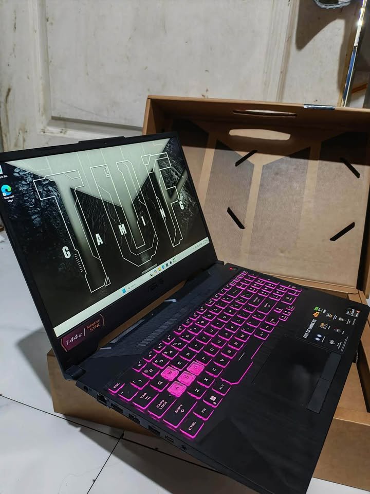 ASUS TUF Gaming A15 laptop during a display test, showing a slightly dim screen